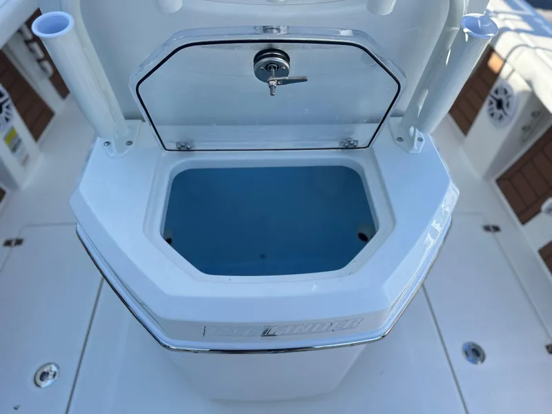 Slide: The Image of Pathfinder 2400 Open 2025 boat livewell with open lid, showcasing interior design. - 16
