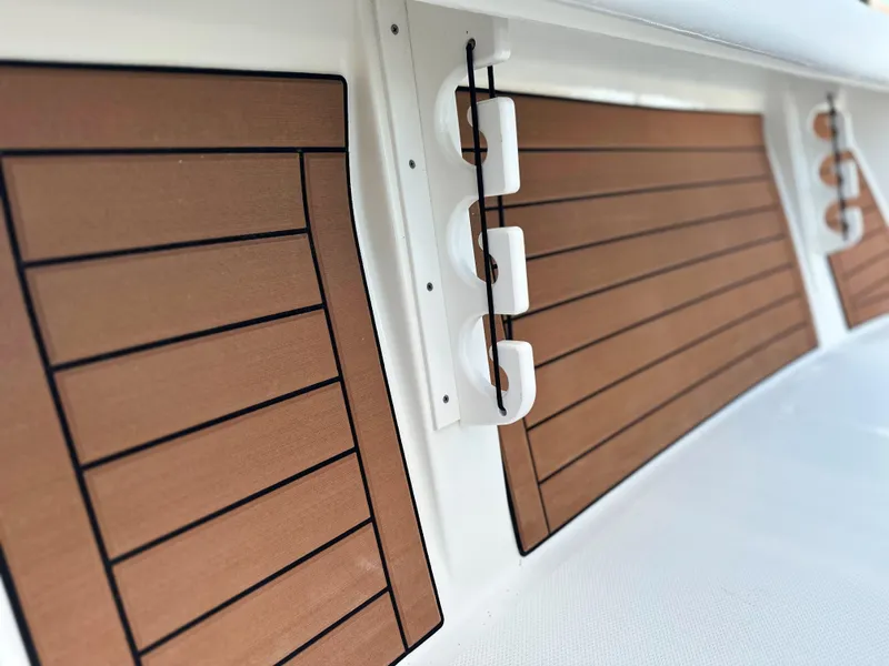 Slide: The Image of 2025 Pathfinder 2400 Open boat interior with wood paneling detail. - 18