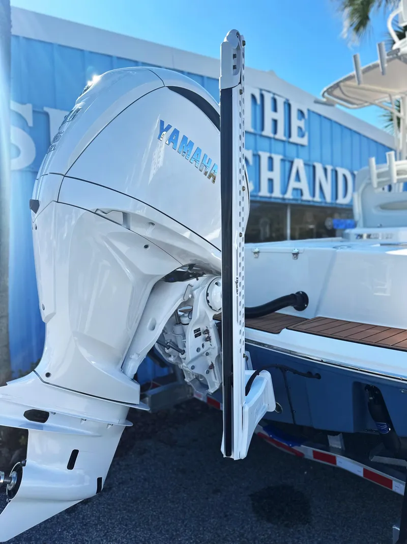 Slide: The Image of 2025 Pathfinder 2400 Open boat with Yamaha outboard motor, displayed outdoors. - 29