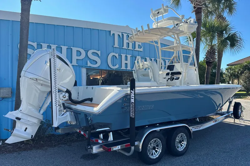 Slide: The Image of 2025 Pathfinder 2400 Open boat on trailer outside marine shop. - 4