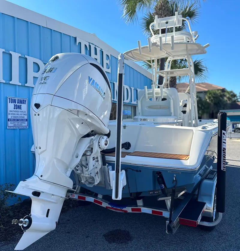 Slide: The Image of 2025 Pathfinder 2400 Open boat with Yamaha engine, parked on a trailer. - 5