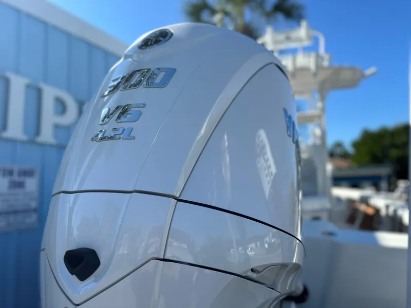 Slide: The Image of Close-up of a 2025 Pathfinder 2400 Open boat engine, showcasing 300 V6 4.2L details. - 6