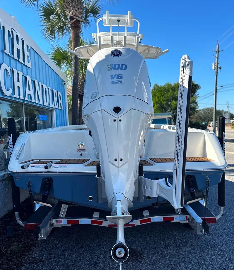 Slide: The Image of 2025 Pathfinder 2400 Open boat with powerful V6 engine, displayed outdoors. - 8