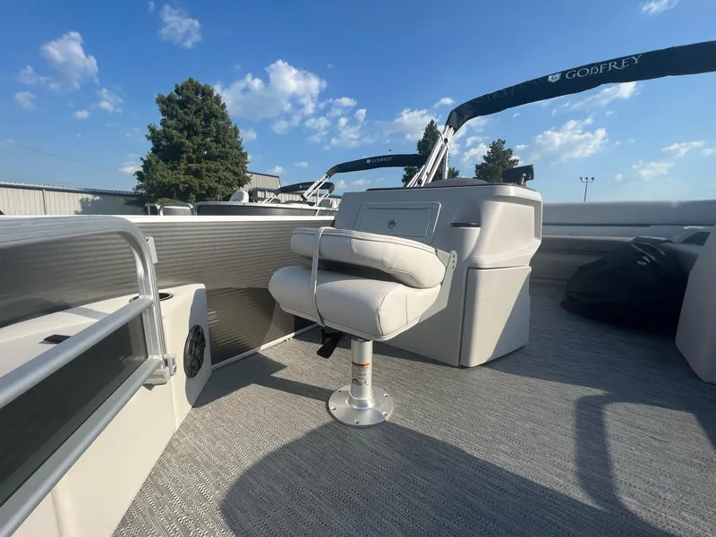 Slide: The Image of 2023 Godfrey Sweetwater Xperience 1680 FX pontoon boat interior with captain's chair. - 11