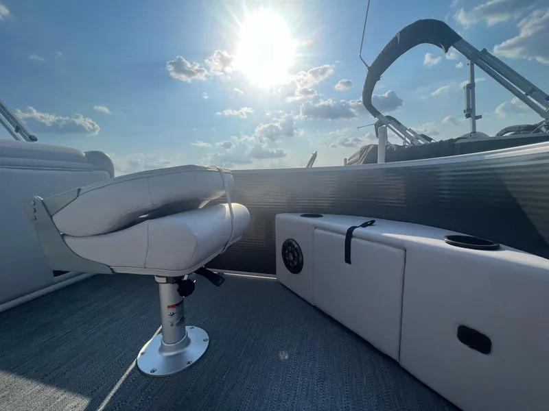 Slide: The Image of 2023 Godfrey Sweetwater Xperience 1680 FX boat interior with seating and storage. - 12