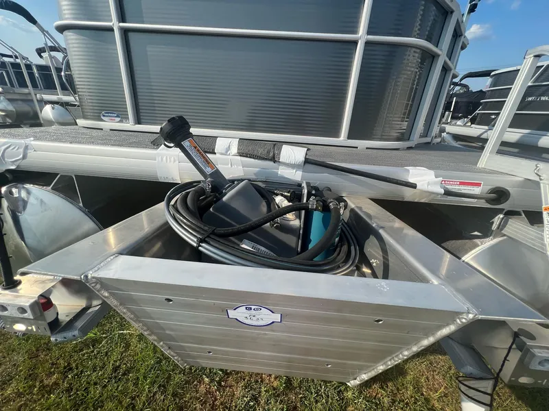Slide: The Image of 2023 Godfrey Sweetwater Xperience 1680 FX pontoon boat with storage compartment. - 16