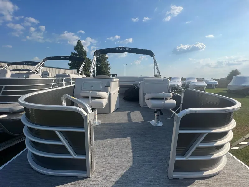 Slide: The Image of 2023 Godfrey Sweetwater Xperience 1680 FX pontoon boat under a clear blue sky. - 8