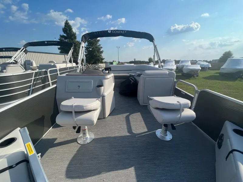 Slide: The Image of 2023 Godfrey Sweetwater Xperience 1680 FX pontoon boat interior with seating and console. - 9
