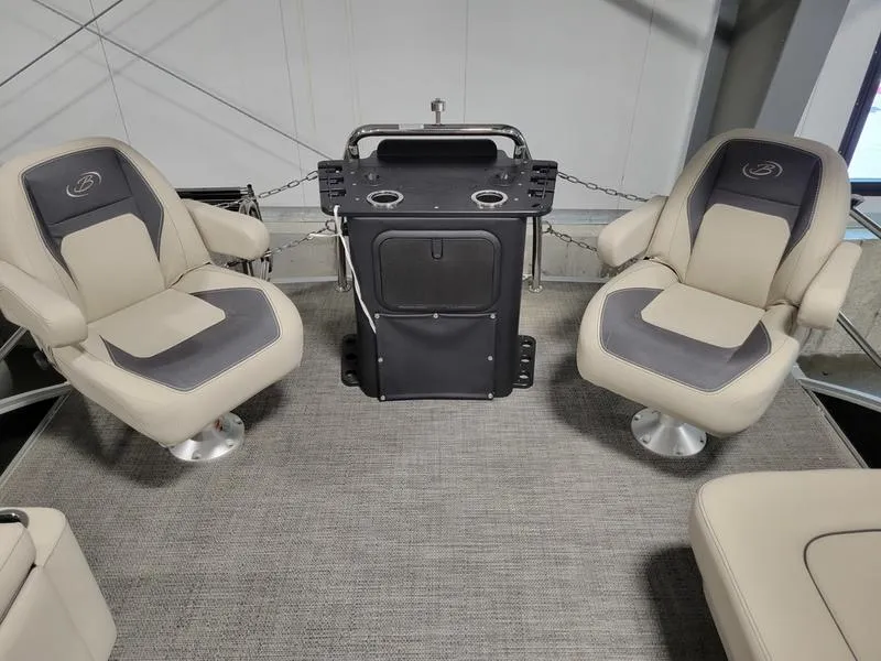 Slide: The Image of 2024 Barletta Aria A22CC boat interior with two cushioned seats and a central console. - 16