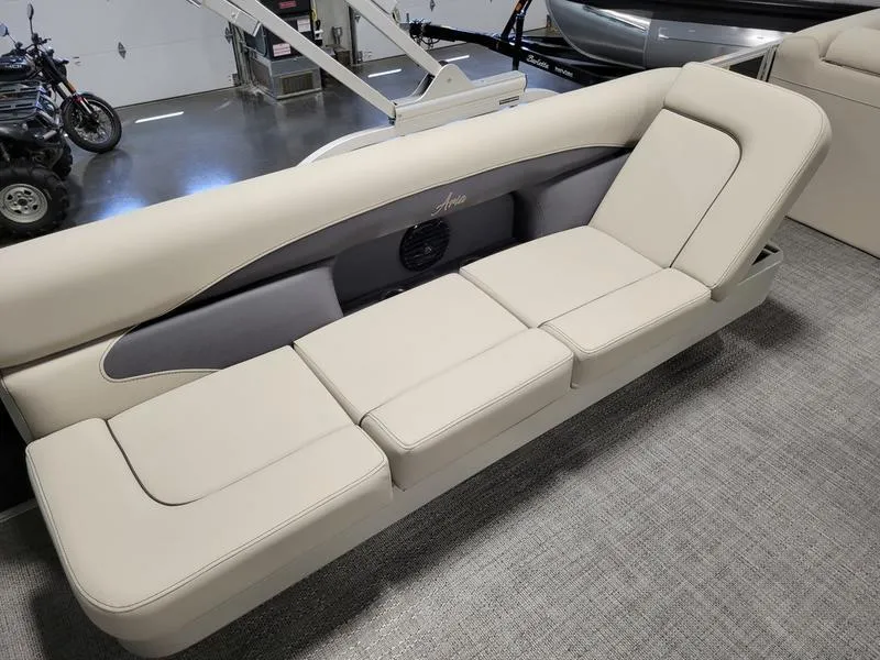 Slide: The Image of 2024 Barletta Aria A22CC boat interior seating with beige upholstery. - 9