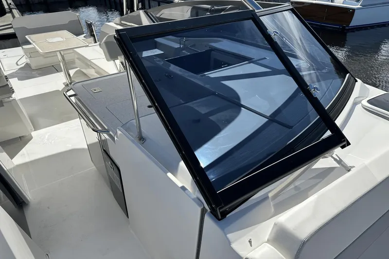 Slide: The Image of 2023 Aquila 32 Sport boat deck with seating and table. - 14
