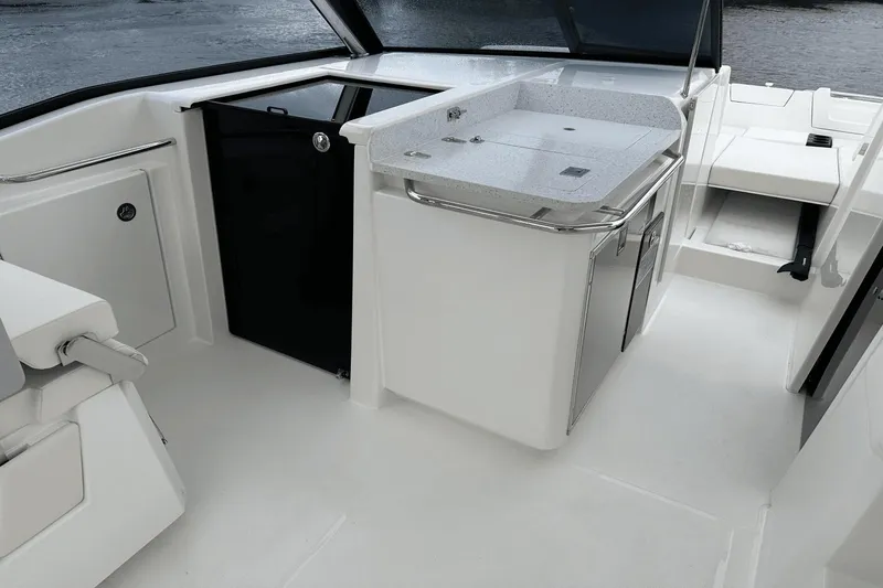 Slide: The Image of Interior of 2023 Aquila 32 Sport boat with modern amenities and sleek design. - 19
