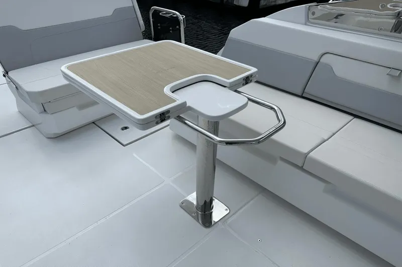 Slide: The Image of Interior seating and table of 2023 Aquila 32 Sport boat. - 27