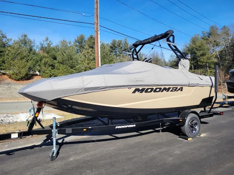 Slide: The Image of 2024 Moomba Mondo boat on trailer with cover, parked outdoors. - 25