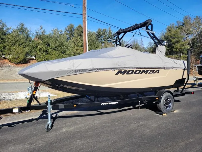 Slide: The Image of 2024 Moomba Mondo boat on trailer with cover, parked outdoors. - 3