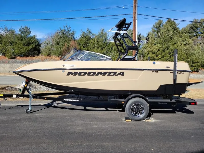 Slide: The Image of 2024 Moomba Mondo boat on trailer, beige color, side view. - 40