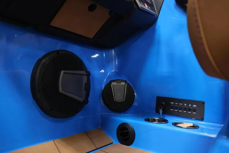 Slide: The Image of 2024 Axis T250 boat interior with speakers and control panel. - 18