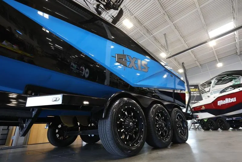 Slide: The Image of 2024 Axis T250 boat on a trailer in a showroom. - 4