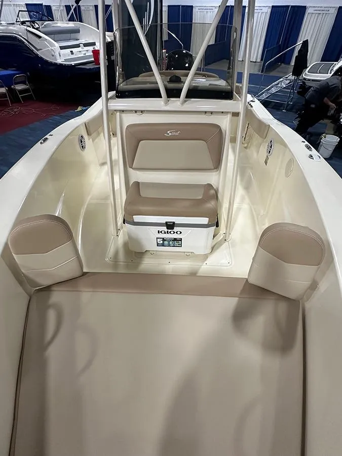 Slide: The Image of 2024 Scout 195 Sportfish boat interior with seating and storage. - 5