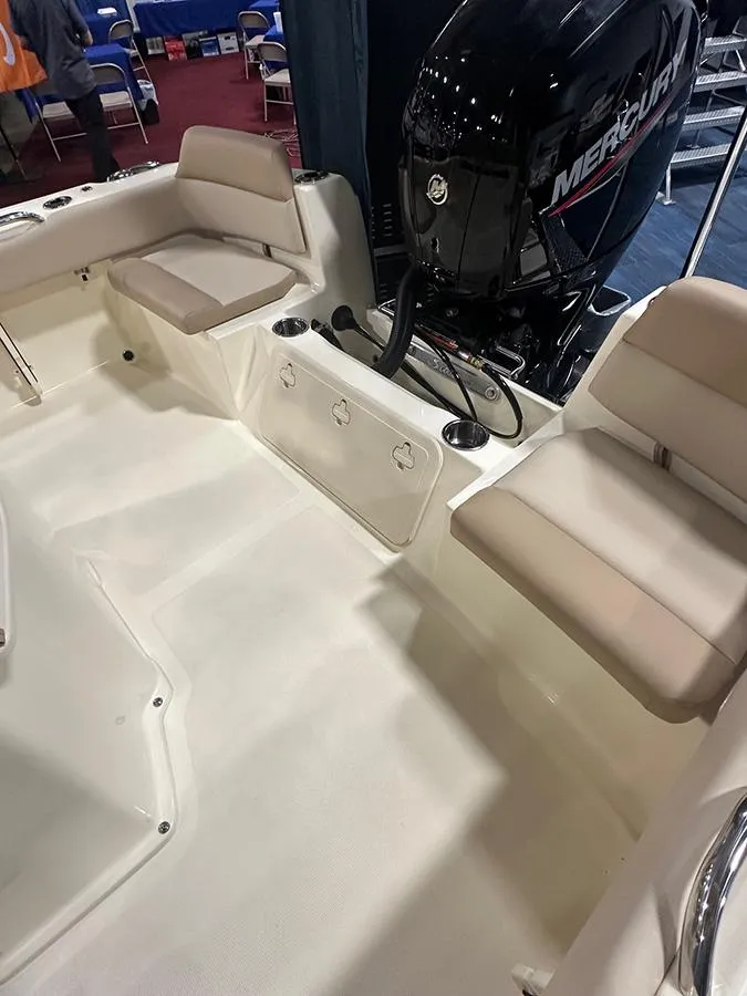 Slide: The Image of 2024 Scout 195 Sportfish boat interior with Mercury engine and seating. - 6