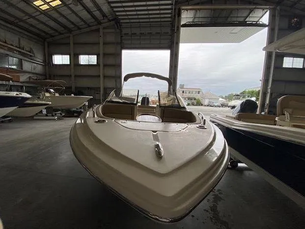 Slide: The Image of 2024 Scout 215 Dorado boat in a storage facility. - 4
