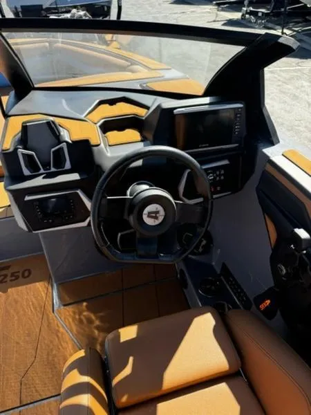 Slide: The Image of 2024 Axis T250 boat interior with modern dashboard and steering wheel. - 9