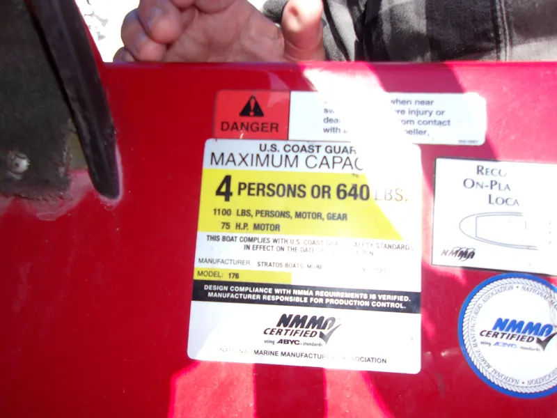 Slide: The Image of 2007 Stratos 176 XT boat capacity label, 4 persons or 640 lbs, 75 HP motor. - 12