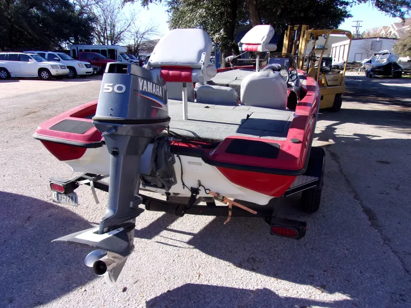Slide: The Image of 2007 Stratos 176 XT boat with Yamaha 50 outboard motor, parked outdoors. - 3