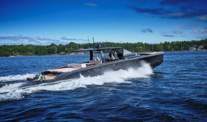 Slide: The Image of 2024 Windy SRL/SR60 luxury yacht cruising on a scenic lake. - 1