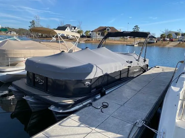 Slide: The Image of 2021 Manitou Oasis 25 SL VP Tritoon docked with cover on. - 13