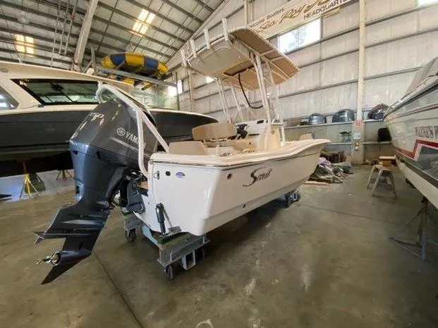 Slide: The Image of 2024 Scout 195 Sportfish boat in a storage facility. - 3