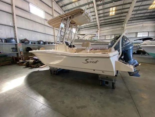 Slide: The Image of 2024 Scout 195 Sportfish boat in indoor storage facility. - 4