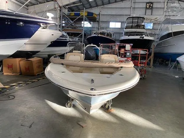 Slide: The Image of 2024 Scout 195 Sport Dorado boat in a storage facility with other boats. - 3