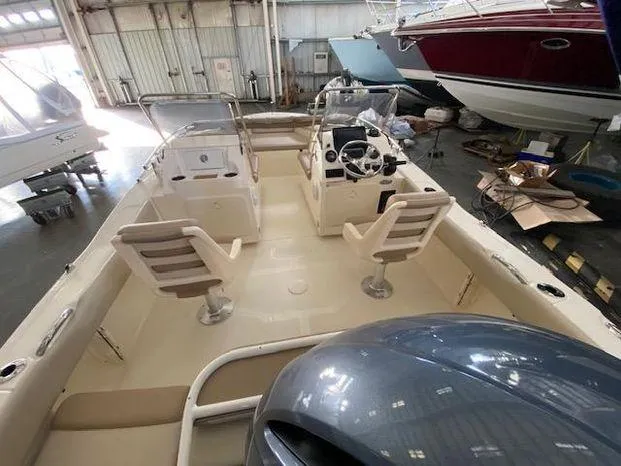 Slide: The Image of 2024 Scout 195 Sport Dorado boat interior in a warehouse. - 9