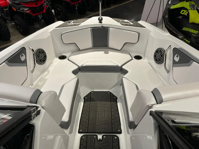 Slide: The Image of 2024 Scarab 215 Wake ID boat interior with white and gray seating. - 10
