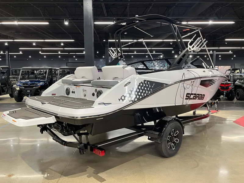Slide: The Image of 2024 Scarab 215 Wake ID boat on display in showroom. - 2