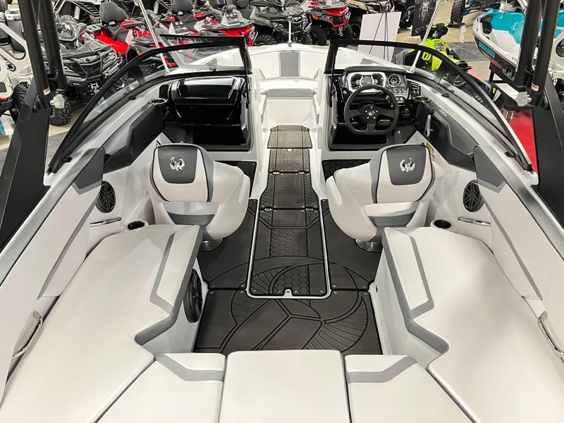Slide: The Image of 2024 Scarab 215 Wake ID boat interior with modern seating and dashboard. - 4