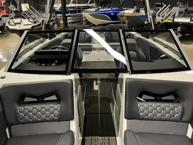 Slide: The Image of 2024 Scarab 235 Wake ID boat interior with modern seating and windshield. - 10