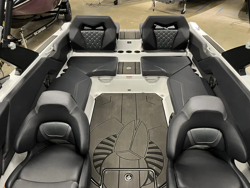 Slide: The Image of 2024 Scarab 235 Wake ID boat interior with black seating and stylish flooring. - 11