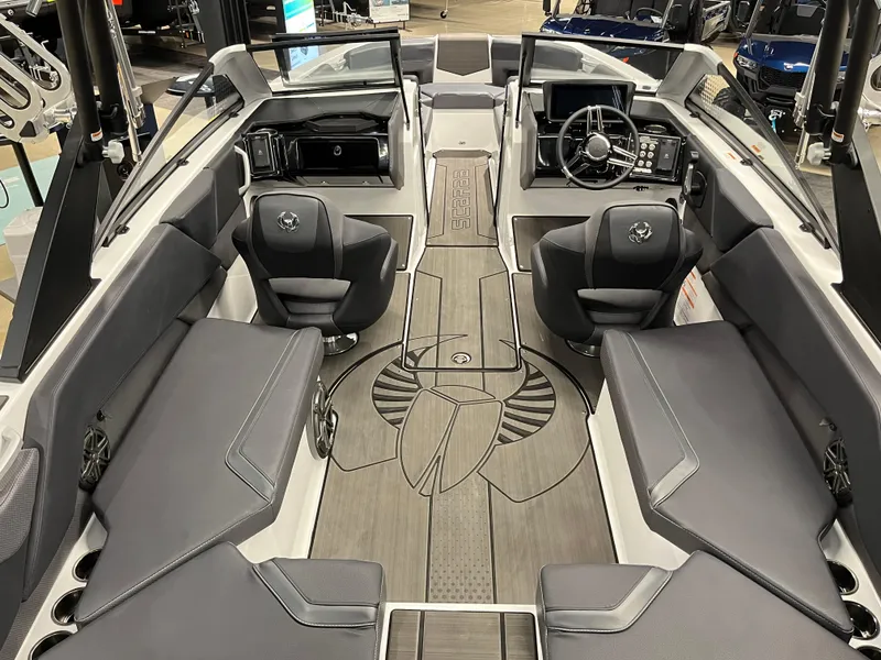 Slide: The Image of 2024 Scarab 235 Wake ID boat interior with sleek seating and modern dashboard. - 7
