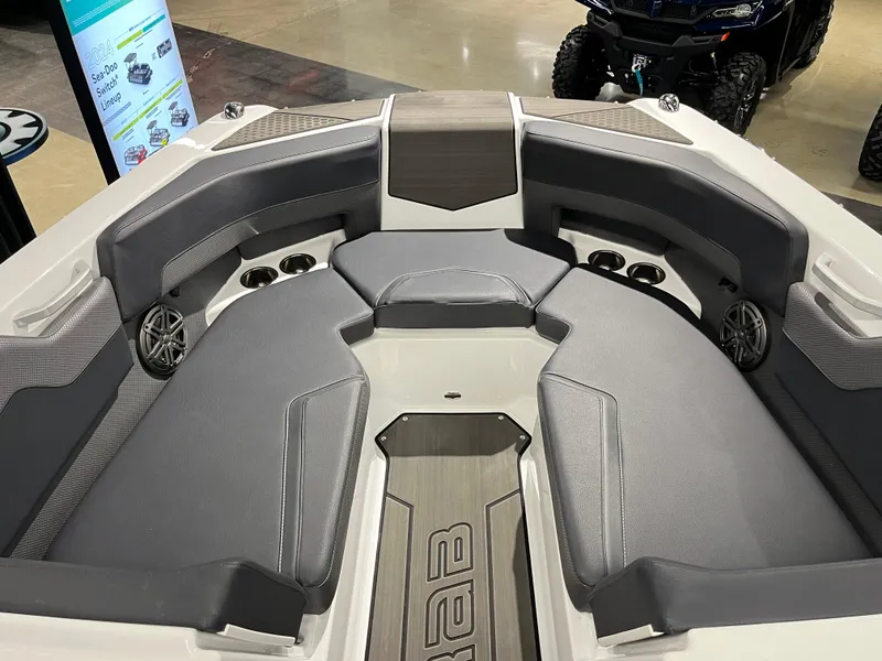 Slide: The Image of 2024 Scarab 235 Wake ID boat interior with gray seating and modern design. - 9