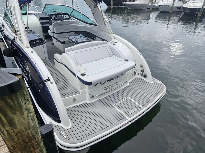 Slide: The Image of 2018 Formula 350 Sun Sport boat docked, featuring spacious seating and sleek design. - 12