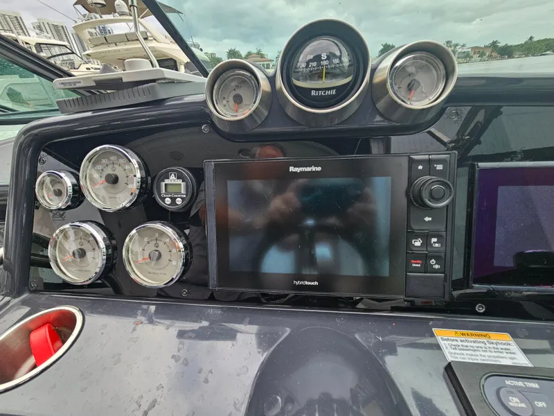 Slide: The Image of Dashboard of 2018 Formula 350 Sun Sport with gauges and Raymarine display. - 21