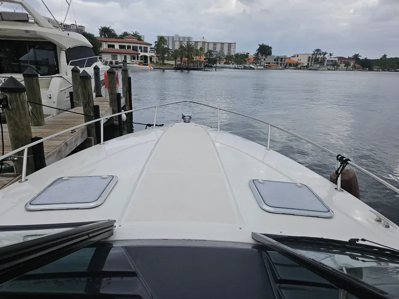 Slide: The Image of 2018 Formula 350 Sun Sport boat docked by waterfront homes. - 3