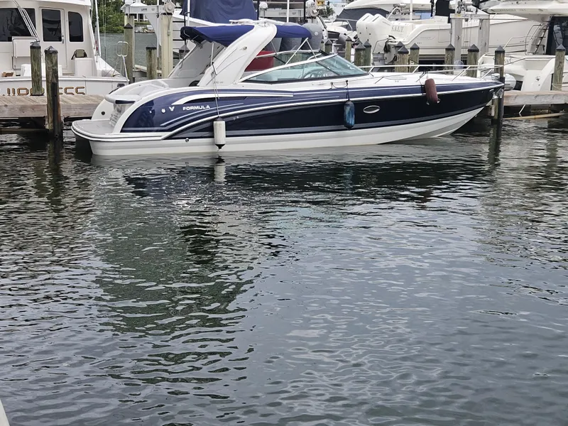 Slide: The Image of 2018 Formula 350 Sun Sport boat docked in marina. - 4