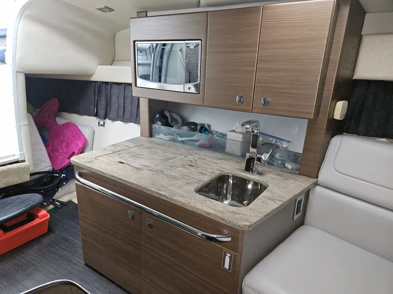 Slide: The Image of 2018 Formula 350 Sun Sport cabin with kitchenette, sink, and microwave. - 43