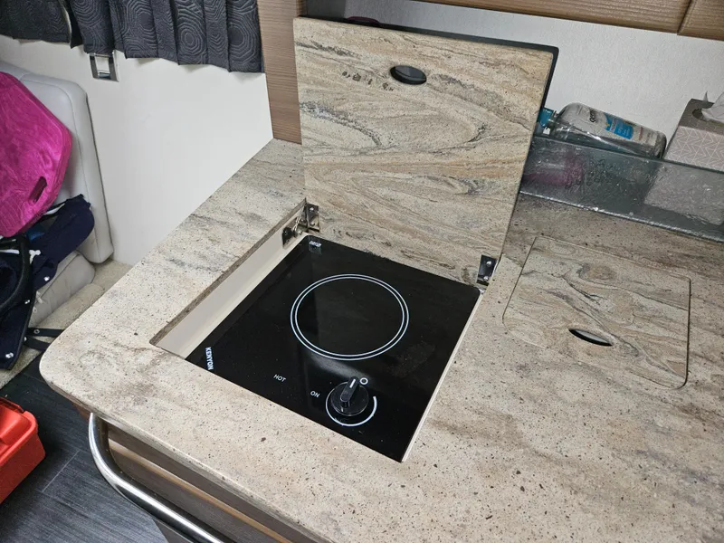 Slide: The Image of 2018 Formula 350 Sun Sport boat interior with built-in electric stove. - 44