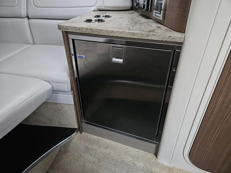 Slide: The Image of 2018 Formula 350 Sun Sport interior with stainless steel mini-fridge and seating area. - 45