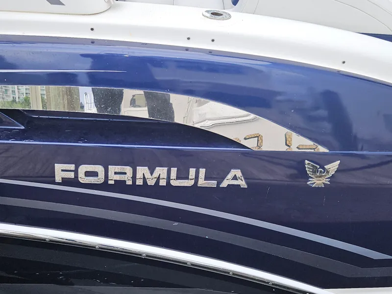 Slide: The Image of 2018 Formula 350 Sun Sport boat with blue and silver detailing. - 8