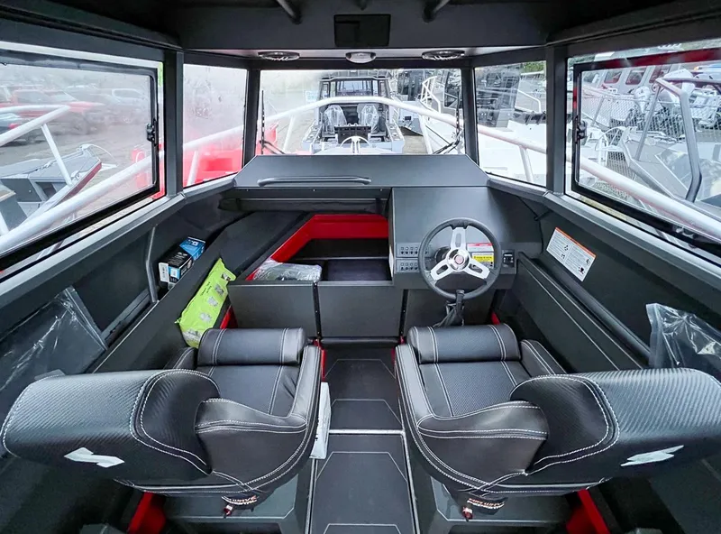 Slide: The Image of Interior of 2024 Stabicraft 2250 Alpha Ultra Centrecab with modern dashboard and seating. - 11